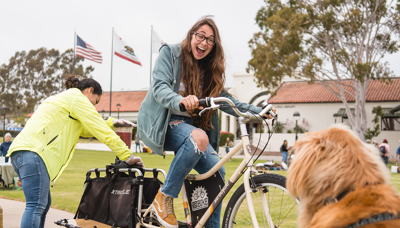 Student riding blender bike